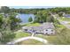 Aerial view of a beautiful home, driveway, and scenic lake at 40 W Laurel St, Apopka, FL 32703