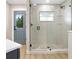 Modern bathroom featuring a frameless glass shower with pebble floor and contemporary fixtures at 40 W Laurel St, Apopka, FL 32703