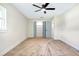 The bedroom includes a ceiling fan and a closet with functional organizers at 40 W Laurel St, Apopka, FL 32703