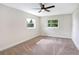Bright bedroom with a modern ceiling fan and great natural light from large windows at 40 W Laurel St, Apopka, FL 32703