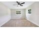 Bright bedroom with a modern ceiling fan and great natural light from large windows at 40 W Laurel St, Apopka, FL 32703