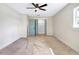 The bedroom includes a ceiling fan and a closet with functional organizers at 40 W Laurel St, Apopka, FL 32703