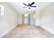 Bedroom with carpet and a closet with pale blue folding doors at 40 W Laurel St, Apopka, FL 32703