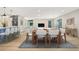 Open-concept dining room with light wood flooring, a dining table, and a view of the kitchen at 40 W Laurel St, Apopka, FL 32703