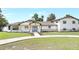Charming single-Gathering home featuring a modern design and a lush green lawn that extends to the waterfront at 40 W Laurel St, Apopka, FL 32703