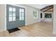 Bright foyer featuring new floors, a view of the front entry doors, and a modern ceiling at 40 W Laurel St, Apopka, FL 32703