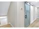 Hallway featuring laminate wood floors, a thermostat, and an accent barn door at 40 W Laurel St, Apopka, FL 32703