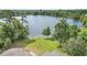 Scenic lake view from the property, complete with lush trees, creating a serene and private backdrop at 40 W Laurel St, Apopka, FL 32703