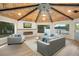 Inviting living room with wood ceiling, fireplace, and expansive windows offering scenic water views at 40 W Laurel St, Apopka, FL 32703