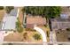 Aerial view showing roof and driveway surrounded by a tidy lawn with mature trees and landscaping at 4015 Kirkland Blvd, Orlando, FL 32811