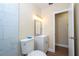 Bathroom featuring modern vanity, lighting, toilet, and tiled shower at 4015 Kirkland Blvd, Orlando, FL 32811