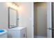 Bathroom featuring a modern vanity, mirror, and a doorway to an adjoining room at 4015 Kirkland Blvd, Orlando, FL 32811
