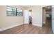 Bedroom showcasing natural light with wood-look flooring and neutral walls at 4015 Kirkland Blvd, Orlando, FL 32811