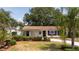 Charming single-story home featuring a well-manicured lawn, new driveway, and inviting curb appeal at 4015 Kirkland Blvd, Orlando, FL 32811