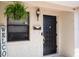 Inviting front entrance featuring a stylish black door and decorative accents at 4015 Kirkland Blvd, Orlando, FL 32811