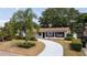 Charming front yard with palm tree, walkway, landscape, and beautiful curb appeal at 4015 Kirkland Blvd, Orlando, FL 32811
