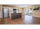 Open kitchen featuring white cabinets, stainless steel appliances, and an island at 4015 Kirkland Blvd, Orlando, FL 32811