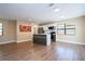 Open concept kitchen with stainless steel appliances and light wood flooring at 4015 Kirkland Blvd, Orlando, FL 32811