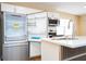 Modern kitchen featuring stainless steel appliances and stone countertops at 4015 Kirkland Blvd, Orlando, FL 32811