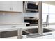 Close up of a modern kitchen sink with stainless steel faucet and soap dispenser at 4015 Kirkland Blvd, Orlando, FL 32811