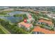 Aerial view of lakeside apartments with lush landscaping and nearby amenities at 4024 Breakview Dr # 40604, Orlando, FL 32819