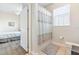 Bathroom with a shower-tub combo and a view of the bedroom at 4024 Breakview Dr # 40604, Orlando, FL 32819