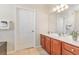 Bathroom with cherry wood cabinets, white countertops and tile floors at 4024 Breakview Dr # 40604, Orlando, FL 32819