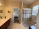 Primary bathroom featuring a vanity with dual sinks, shower/tub combo, and linen closet at 4024 Breakview Dr # 40604, Orlando, FL 32819