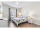 Cozy bedroom with warm hardwood floors and natural light from the window at 4024 Breakview Dr # 40604, Orlando, FL 32819