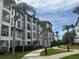 Elegant condo building exterior with well-manicured lawns and walking paths at 4024 Breakview Dr # 40604, Orlando, FL 32819