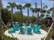 Cozy fire pit surrounded by Adirondack chairs in a tropical outdoor setting at 4024 Breakview Dr # 40604, Orlando, FL 32819