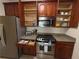 Functional kitchen features stainless steel appliances and ample wooden cabinet storage at 4024 Breakview Dr # 40604, Orlando, FL 32819
