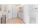 Laundry room with white washer and dryer on ceramic tile floor at 4024 Breakview Dr # 40604, Orlando, FL 32819