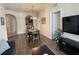 Cozy living room with wood floors, dining area, and archway to the kitchen at 4024 Breakview Dr # 40604, Orlando, FL 32819
