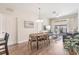 Open floor plan with dining area leading to the living room and outdoor balcony at 4024 Breakview Dr # 40604, Orlando, FL 32819