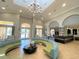 Spacious lobby with elegant chandelier, comfortable seating, and reception desk welcomes residents and guests at 4024 Breakview Dr # 40604, Orlando, FL 32819