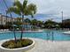 Resort-style pool area featuring lounge chairs, palm trees, and a refreshing swimming pool for relaxation and enjoyment at 4024 Breakview Dr # 40604, Orlando, FL 32819