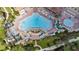 Aerial view of a resort-style swimming pool area with various amenities and lush landscaping at 4024 Breakview Dr # 40604, Orlando, FL 32819