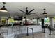 Poolside bar area with stone facade and ceiling fans, providing a relaxing space to enjoy drinks and socialize at 4024 Breakview Dr # 40604, Orlando, FL 32819
