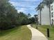 Scenic walking path through lush landscaping near condo buildings at 4024 Breakview Dr # 40604, Orlando, FL 32819