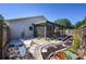 The backyard features stepping stones leading to gardens with a screened-in porch at 4216 Cricket Hollow Cv, Casselberry, FL 32707