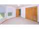 Bedroom features carpeted floors, closet and natural light at 4216 Cricket Hollow Cv, Casselberry, FL 32707
