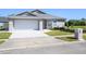 Charming single-story home featuring a well-maintained lawn and a two-car garage at 4216 Cricket Hollow Cv, Casselberry, FL 32707