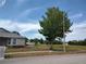 A cozy home with a spacious front lawn and a large tree at 4216 Cricket Hollow Cv, Casselberry, FL 32707