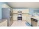 Spacious kitchen featuring stainless steel appliances and white cabinets at 4216 Cricket Hollow Cv, Casselberry, FL 32707