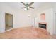 Cozy living room with fireplace and tile flooring, with an opening to another room at 4216 Cricket Hollow Cv, Casselberry, FL 32707
