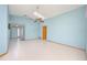 Spacious living room with tile floors, a skylight, and neutral paint at 4216 Cricket Hollow Cv, Casselberry, FL 32707