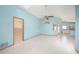 Open-concept living room with tile floors, ceiling fan and natural light at 4216 Cricket Hollow Cv, Casselberry, FL 32707