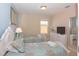 A comfortable bedroom with two twin beds and soft floral bedding, accompanied by natural light at 4405 Acorn Ct, Davenport, FL 33837