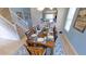 Traditional dining room featuring a wooden table with seating for eight and natural light from the windows at 4405 Acorn Ct, Davenport, FL 33837